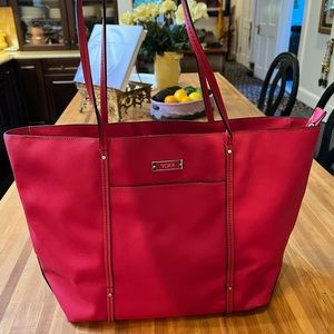TUMI Saffiano leather cranberry-red tote with zipper closure. Silver hardware